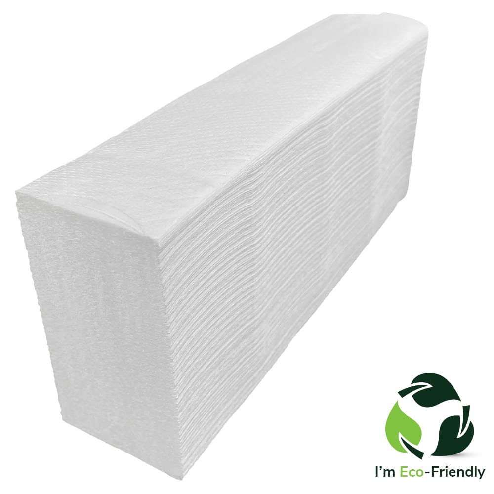 A narrow pile of white hand towels on a white background