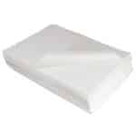 Well-arranged stack of white strong wipes with the top wipe gracefully curved at an angle against a plain background.