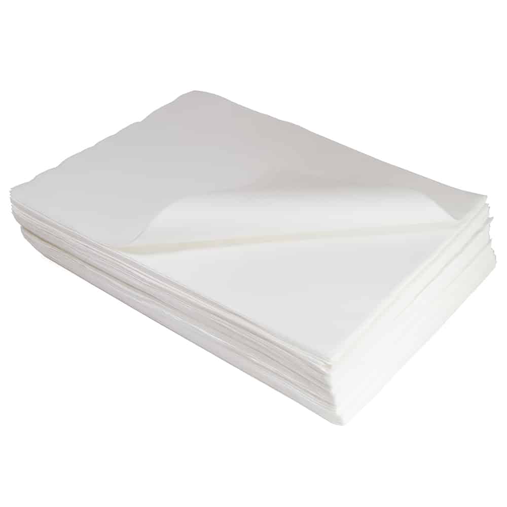 Well-arranged stack of white strong wipes with the top wipe gracefully curved at an angle against a plain background.
