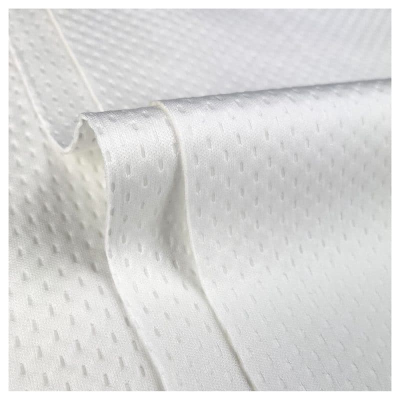 Close up of the quilted texture of thick wipes ("Polysoft wipes") with a curve in the middle