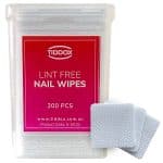a clear container of TIDDOX nail polisher removal wipes with a reddish label with three nail polish remover wipes on the right-side