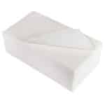 Neatly stacked wipes top wipe curved to the side open with a plain background