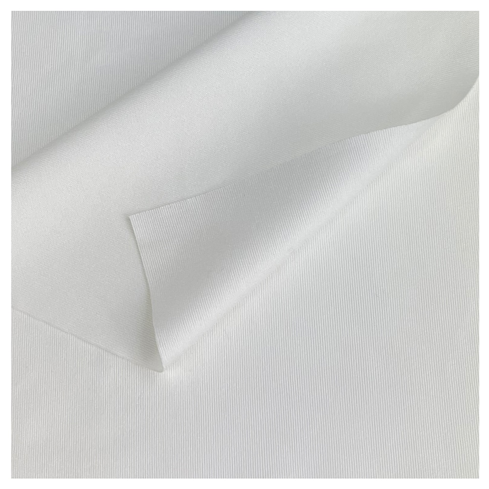 A close up of TIDDOX white polyester wipes with the top left corner curved over itself