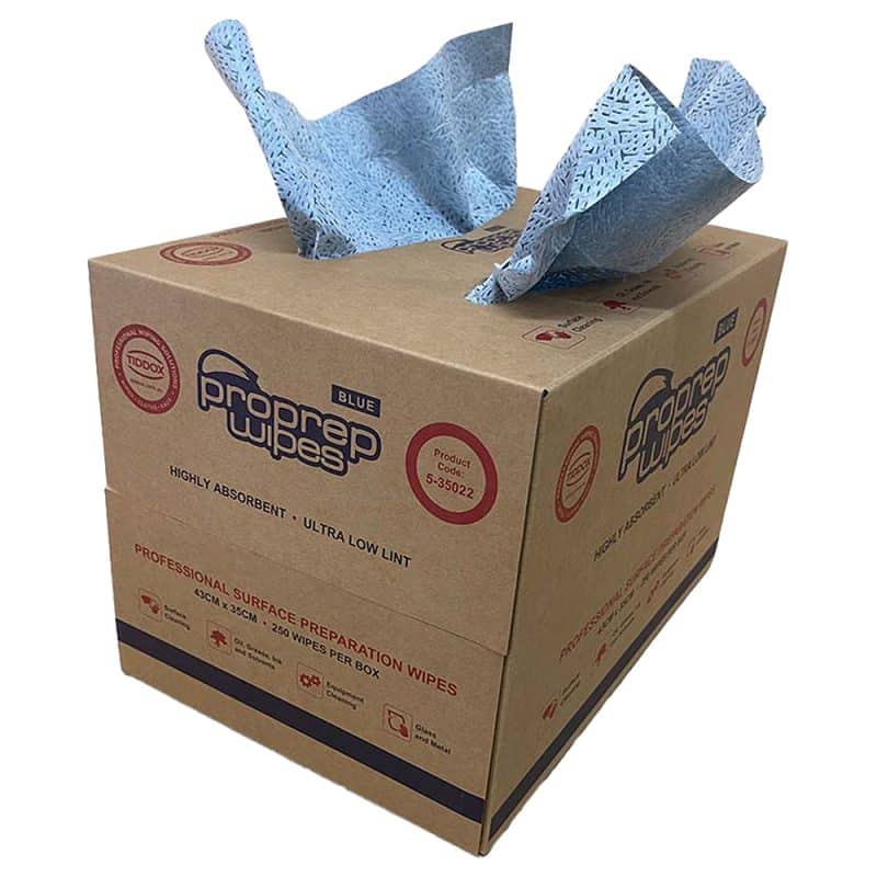 Brown carry-sized dispenser box of blue Proprep Wipes with two wipes sticking out the top