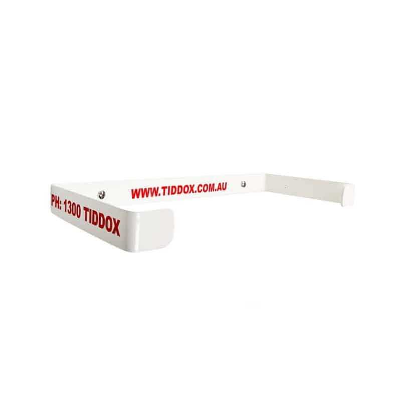 Wall-mounted wipes roll holder for TIDDOX wipes rolls in white with red writing